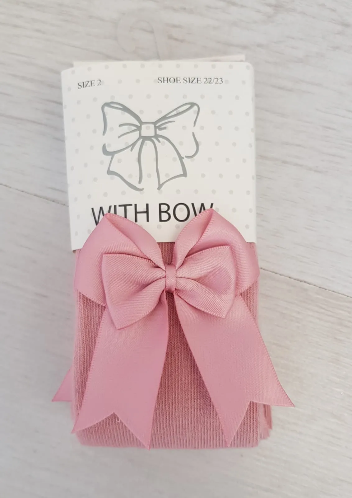 Dusky pink bow tights